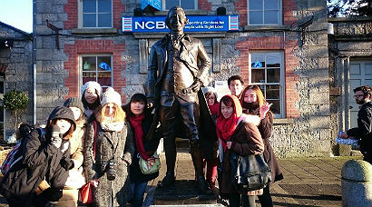 Tourists with statue of Arthur Guinness in Celbridge